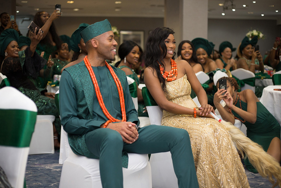 Bride and groom smile as they watch the dancefloor